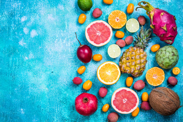 istock Exotic fruits top view border background 906869726