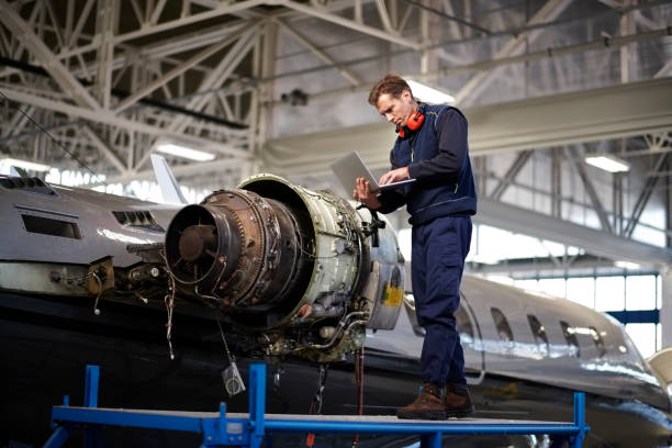 istock Aircraft mechanic in the hangar 906870224
