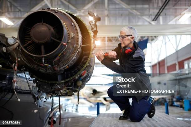 Aircraft Mechanic In The Hangar Stock Photo - Download Image Now - Engineer, Aerospace Industry, Women