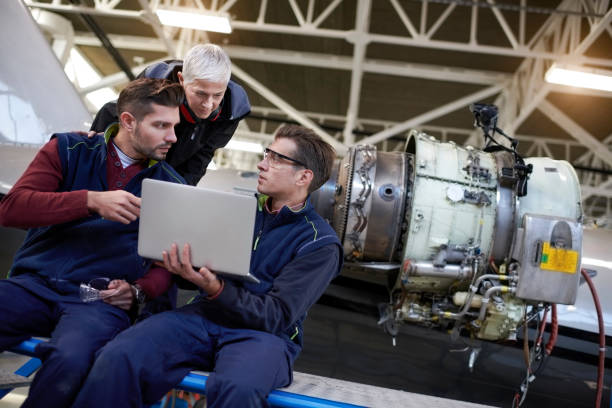 istock Aircraft mechanics in the hangar 906870694
