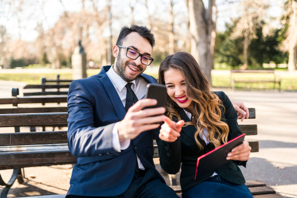 istock Business people having a break in the park 906870766