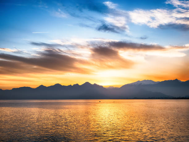 istock Nature background with sea and mountanes landscape at sunset 906870818