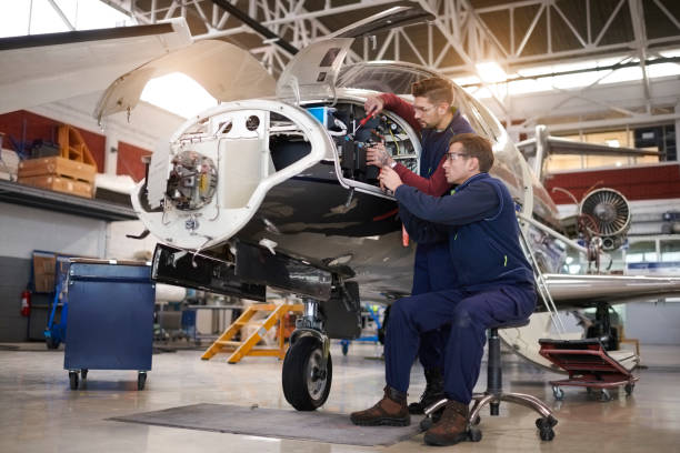 istock Aircraft mechanics in the hangar 906871552