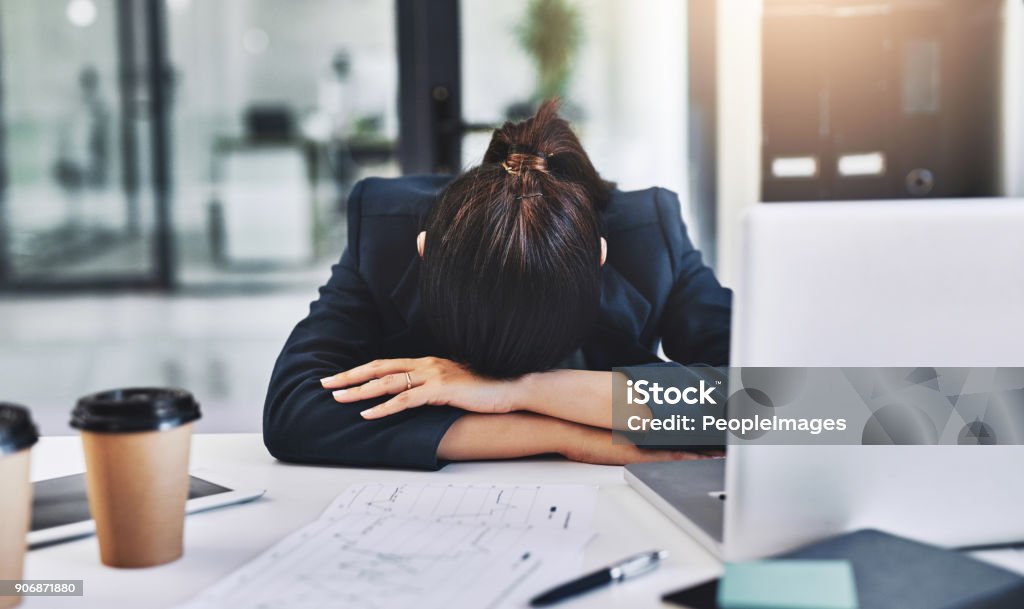 Today has been one busy day, she's exhausted Cropped shot of an unrecognizable businesswoman sleeping in her office 20-29 Years Stock Photo