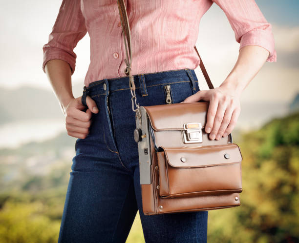istock Young woman in deep blue jeans holding a bag 906878652