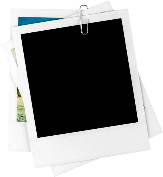 istock One Blank Frame and Two Photos with a Paper Clip - Isolated 906882368