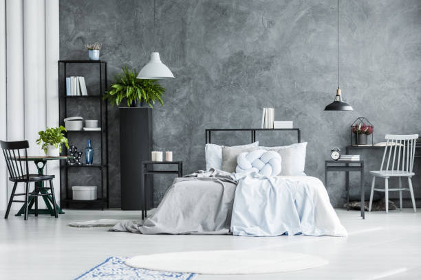 istock Spacious bedroom interior with chair 906882960