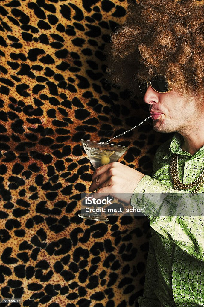 Spitini A man spitting his martini back into the glass Men Stock Photo