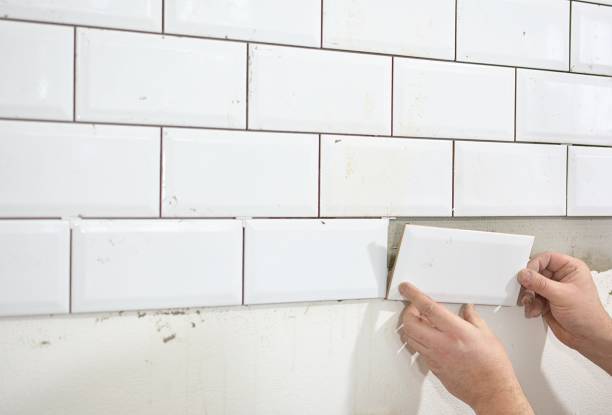 istock tiling the tiles in the kitchen 906889234