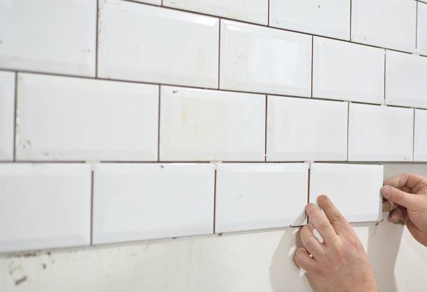 istock tiling the tiles in the kitchen 906889266