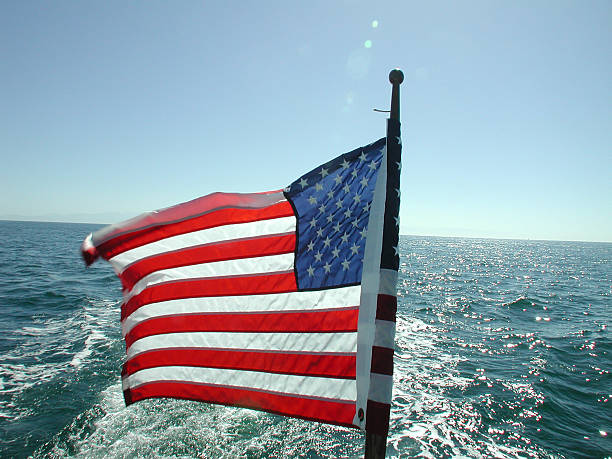 istock American flag against water and skyline 90688938