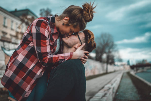 istock Beautiful young couple having fun outdoors on a lovely day 906895052
