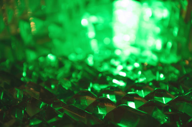 istock Close up of crystal facets in mysterious emerald light.Magic shiny background.Abstract. 906902320
