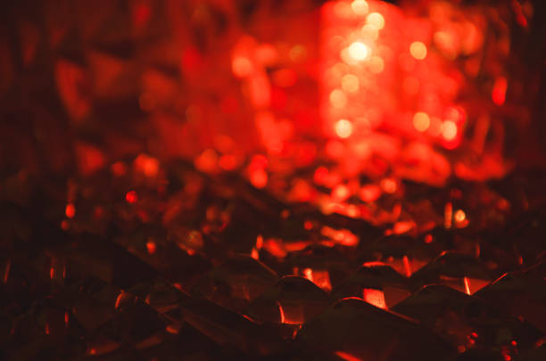 istock Close up of crystal facets in mysterious ruby light.Magic shiny background.Abstract. 906902382