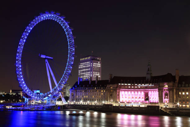 London Eye and  County Hall London, UK, September 13, 2011 : Thames cityscape at night showing the London Eye and  County Hall london county hall stock pictures, royalty-free photos & images