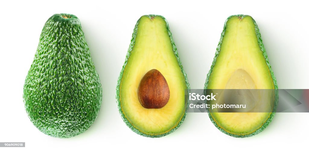 Isolated cut avocado Isolated avocado. Whole avocado fruit and two halves in a row isolated on white background with clipping path Avocado Stock Photo