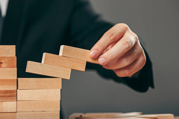 istock Man and wooden cubes on table. Management concept 906910800