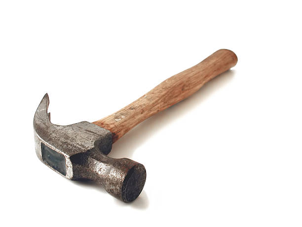 istock A hammer with a wooden handle on a white background 90692621