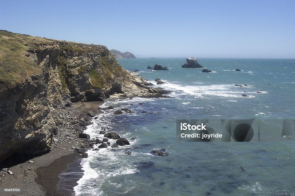 End of Earth, Start of Sea Where the cliffs and beach meet the sea California State Route 1 Stock Photo