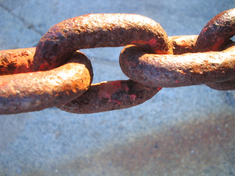 Rusty chains with stone background