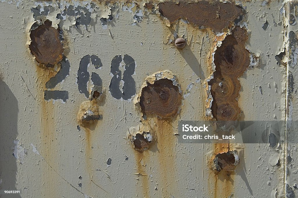 A rusty door with the number 268 on it.  Entire object is in focus. Backgrounds Stock Photo