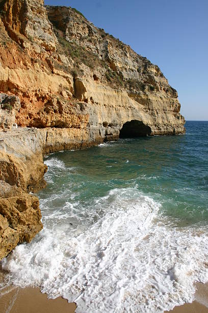 Coast Algarve United Kingdom Coast Algarve Portugal near Carvoeiro. Small beach between the high cliffs. Atlantic ocean. beautiful beach in carvoeiro algarve portugal stock pictures, royalty-free photos & images