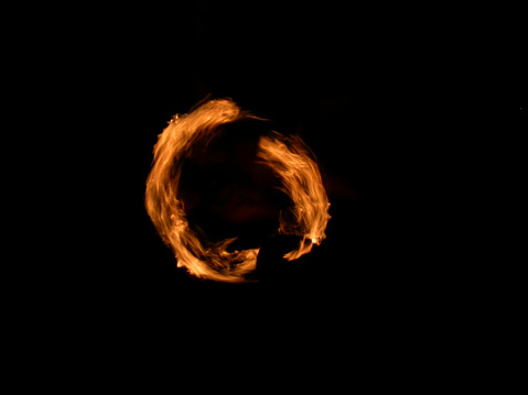 Man twisting fireball on a rope