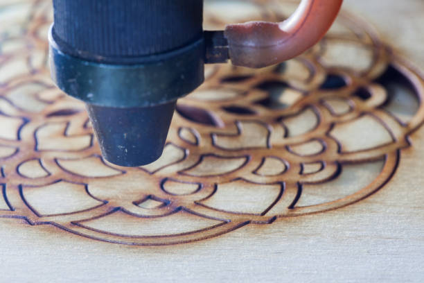istock The laser cuts out a tree in the form of a mandala 906954278