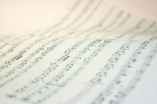 A music book open with music notes in black and white
