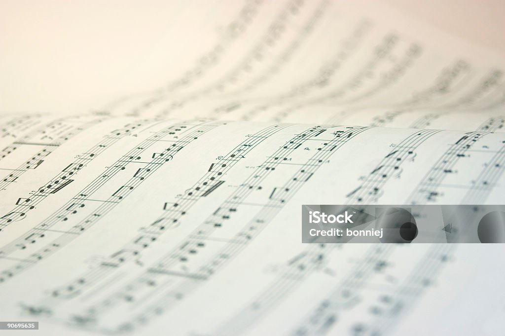 A music book open with music notes in black and white Very high key image of a music score. Sheet Music Stock Photo