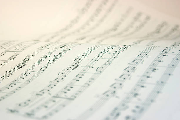 A music book open with music notes in black and white Very high key image of a music score. sheet music photos stock pictures, royalty-free photos & images