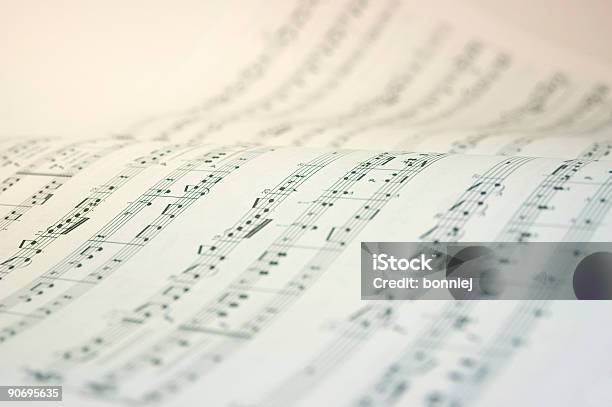 A Music Book Open With Music Notes In Black And White Stock Photo - Download Image Now