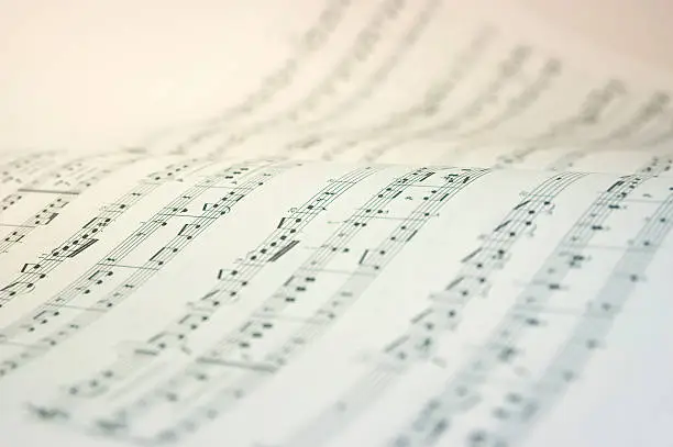 Photo of A music book open with music notes in black and white