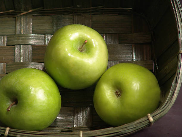 grünen äpfel - three objects three people three animals apple stock-fotos und bilder
