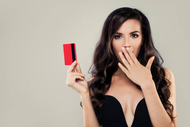 pretty girl woman holding credit card - female stripper imagens e fotografias de stock