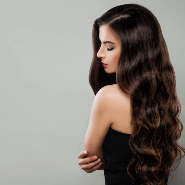istock Brunette woman in black dress 906962248