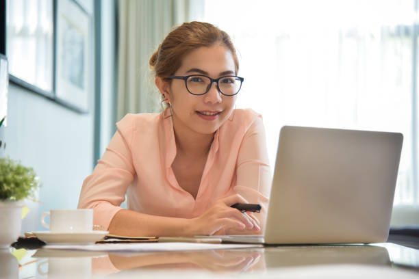 istock Happy Young Asian Female creative designer working. 906962872