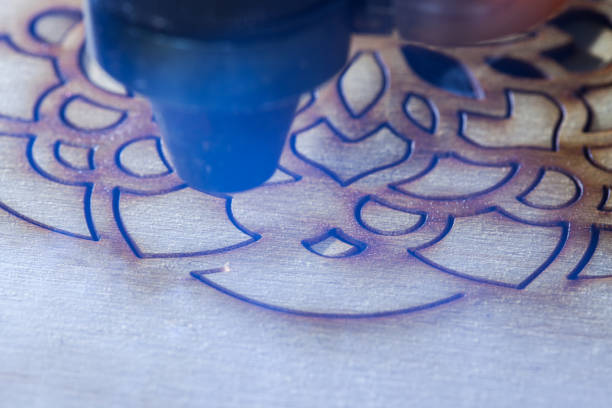 istock The laser cuts out a tree in the form of a mandala 906963584