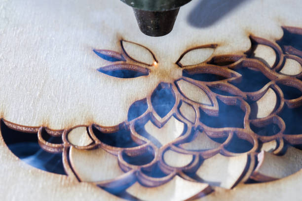 istock The laser cuts out a tree in the form of a mandala 906963710