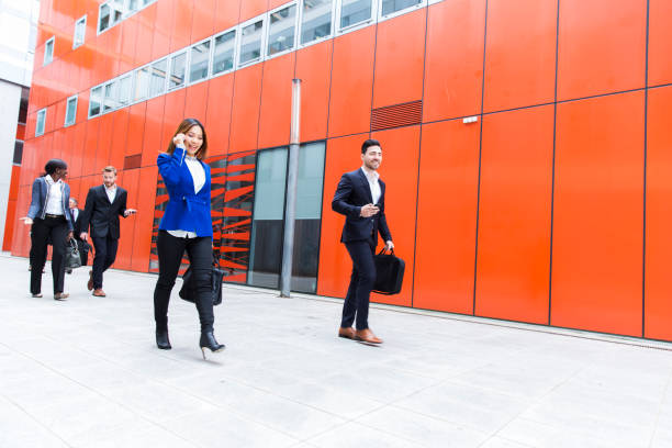 istock Business people walking on a street 906963816