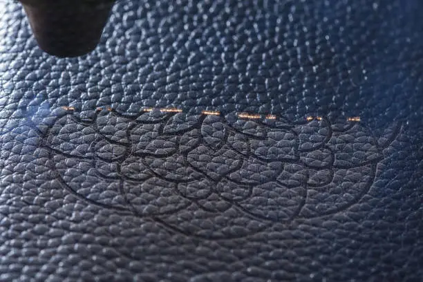 Laser makes engraving on leather