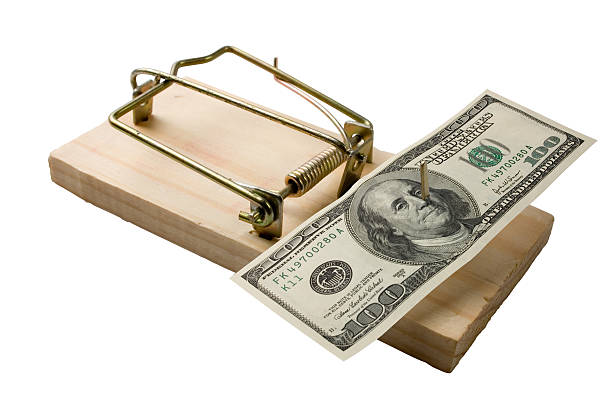 Mouse trap with bucks stock photo