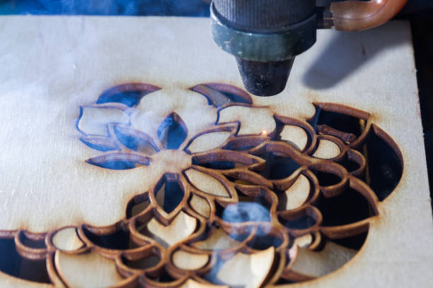 istock The laser cuts out a tree in the form of a mandala 906969584