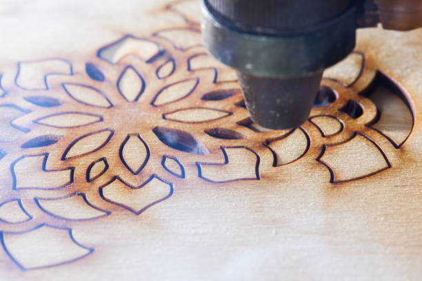 istock The laser cuts out a tree in the form of a mandala 906971412