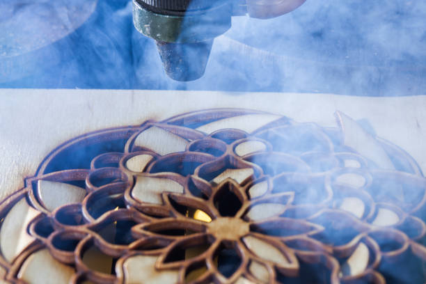istock The laser cuts out a tree in the form of a mandala 906971910