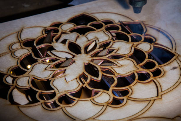 istock The laser cuts out a tree in the form of a mandala 906972168