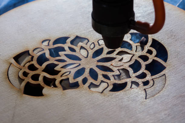 istock The laser cuts out a tree in the form of a mandala 906972314