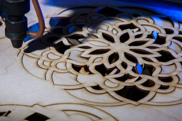 istock The laser cuts out a tree in the form of a mandala 906998392