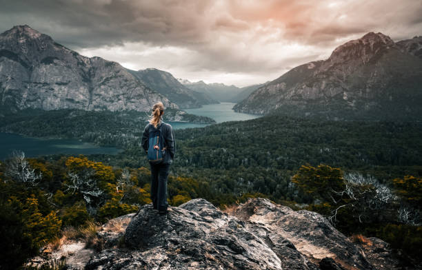 woman hiker stands and enjoys valley view - argentina landscape scenics south america imagens e fotografias de stock