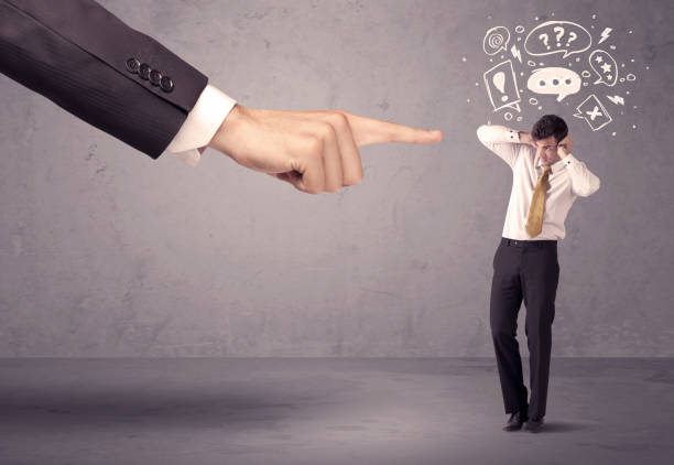 istock Boss hand pointing at confused employee 907006122